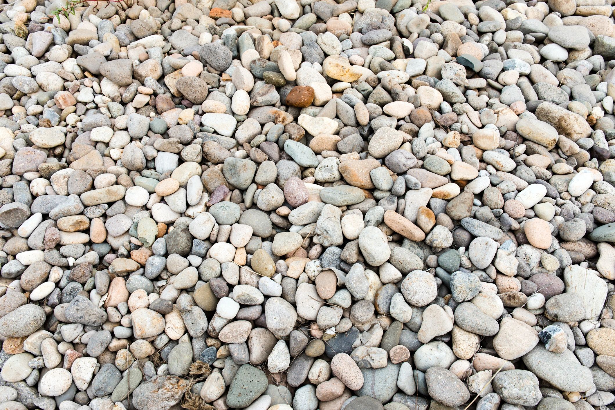 Smooth cobblestone pebbles background