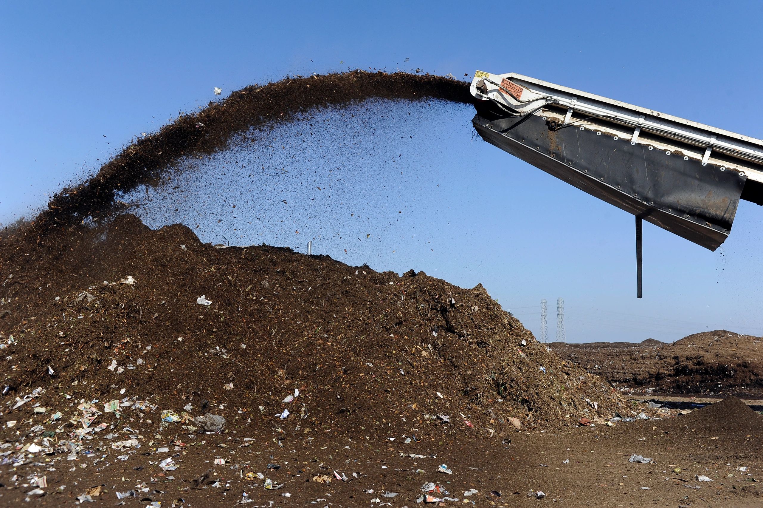 Compost being recycled into topsoil for landscaping use